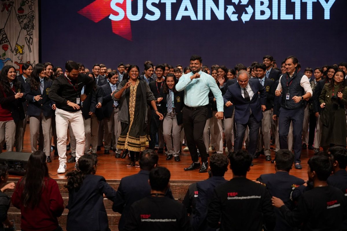 Jothi dancing with students at TEDx event